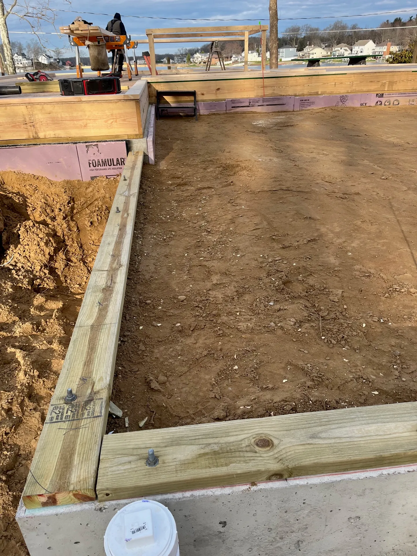 Level excavated foundation base ready for concrete at a Kalamazoo home