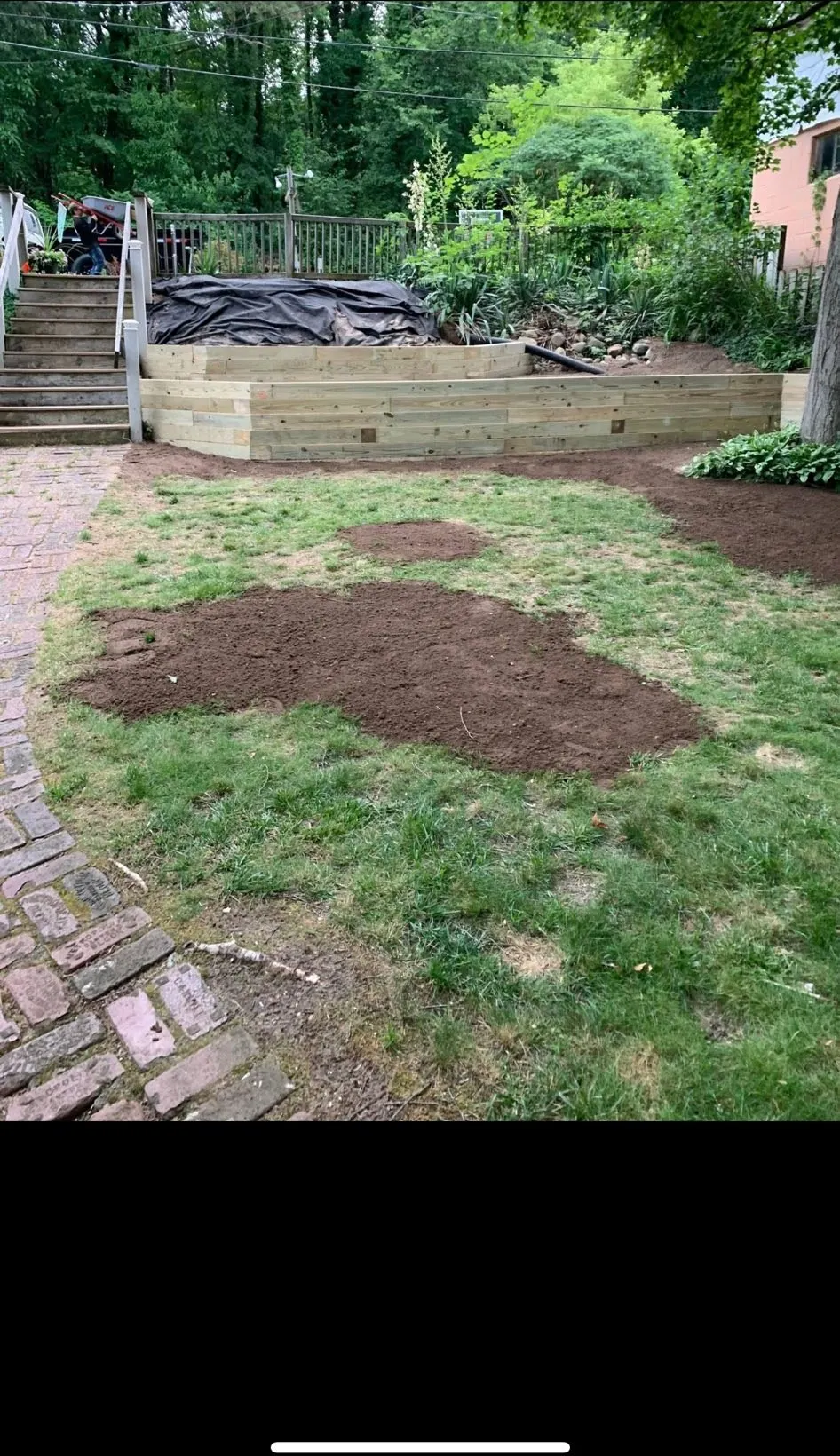 Timber retaining wall built and backyard regraded with fresh topsoil